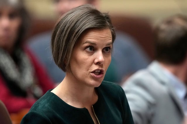 Rep. Laurel D. Libby, R - Auburn, speaks with a colleague, Tuesday, Feb. 14, 2023, at the State House in Augusta, Maine. (AP Photo/Robert F. Bukaty)