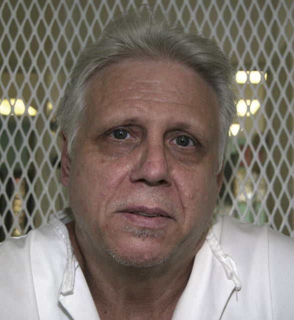 FILE - Convicted killer David Leonard Wood poses for a photo at death row in Huntsville, Texas, July 15, 2009. (AP Photo/Mike Graczyk, File)
