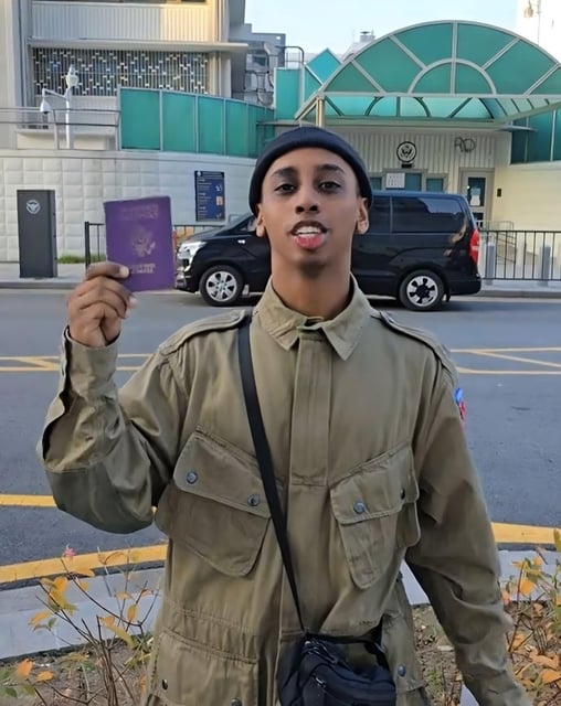 US live-streamer Johnny Somali, real name Ramsey Khalid Ismael, waves around his US passport in a video he posted to TikTok on November 12, 2024. Photo: TikTok/JohnnySomali