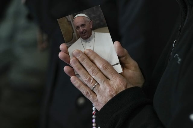 A nun attends a Rosary prayer for Pope Francis, in St. Peter&#39;s Square at the Vatican, Monday, March 10, 2025.