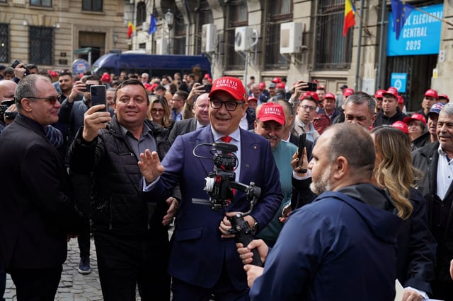 Victor Ponta, former Romanian prime minister, wearing a hat reading "Romania first", leaves after submitting his candidacy for presidential elections, in Bucharest, Romania, March 12, 2025. REUTERS/Andreea Campeanu