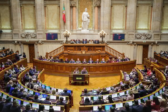 Members of the Portuguese parliament take their seats at the start of a debate preceding the vote on a confidence motion concerning Portuguese Prime Minister Luis Montenegro in Lisbon, Tuesday, March 11, 2025. (AP Photo/Armando Franca)