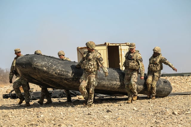 U.S. soldiers assigned to 814th Engineer Company, 11th Engineer Battalion, 2nd Infantry Division carry a raft for deployment during Freedom Shield 25 in Yeoncheon, South Korea, on March 11.
