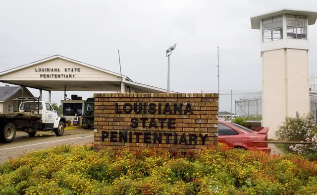 File photo. Vehicles enter at the main security gate at Louisiana State Penitentiary in Angola, Louisiana, on August 5, 2008.