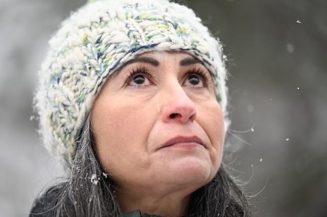 Vanessa Diaz, mother of University of Colorado Boulder student Megan Trussell, looks up to the sky during a memorial ceremony near mile marker 40 in Boulder Canyon on Monday, Feb. 17, 2025. On Saturday, Boulder Open Space and Mountain Parks rangers found a body later confirmed to be Trussell. (Matthew Jonas/Daily Camera)