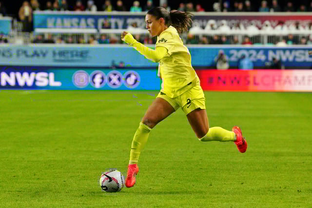 Nov 23, 2024; Kansas City, Missouri, USA; Washington Spirit forward Trinity Rodman (2) controls the ball against the Orlando Pride during the second half in the 2024 NWSL Championship match at CPKC Stadium. Mandatory Credit: Denny Medley-Imagn Images/ File Photo