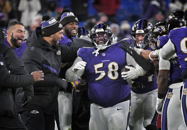 Ravens’ Michael Pierce, center, is mobbed. by teammates celebrating his first career interception that came against the Browns in the fourth quarter. The Ravens defeated the Browns 35-10 at M&amp;T Bank Stadium. (Kenneth K. Lam/Staff)