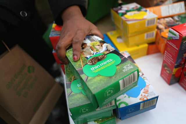 Girl Scouts sell cookies in New York City.
