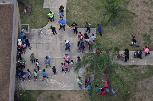 Migrant children make their way inside a building at Casa Presidente, an immigrant shelter for unaccompanied minors, in Brownsville, Texas, U.S., June 23, 2018.  REUTERS/Loren Elliott/File Photo