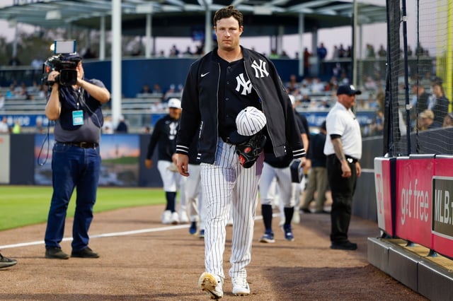 TAMPA, FLORIDA - FEBRUARY 28: Gerrit Cole #45 of the New York Yankees walks towards the dugout from the bullpen prior to a spring training game against the Toronto Blue Jays at George M. Steinbrenner Field on February 28, 2025 in Tampa, Florida.