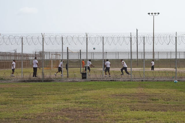 Immigration detainees play outside at the Port Isabel Detention Center in Los Fresnos, Texas, on June 10, 2024. 