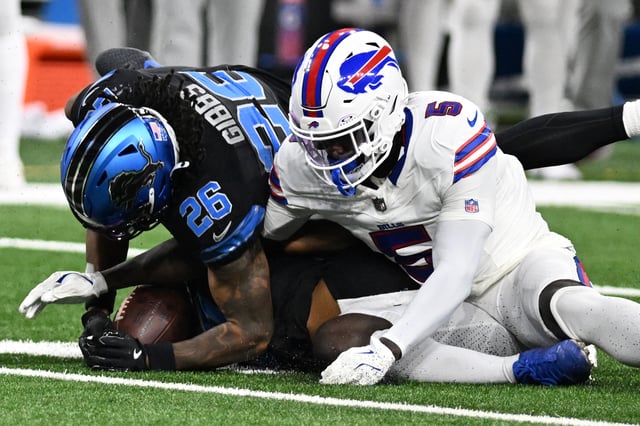 Dec 15, 2024; Detroit, Michigan, USA; Detroit Lions running back Jahmyr Gibbs (26) and Buffalo Bills cornerback Kaiir Elam (5) battle for a fumble in the third quarter at Ford Field. Mandatory Credit: Lon Horwedel-Imagn Images/File Photo