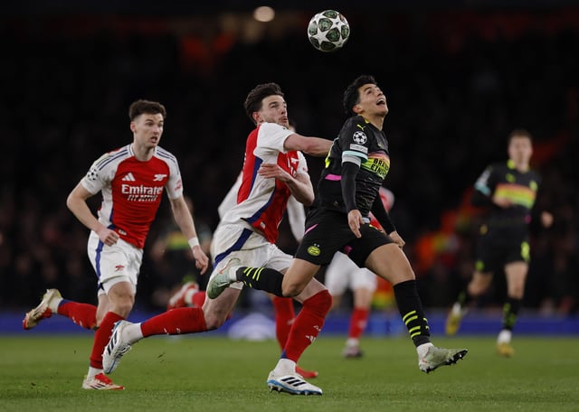 Soccer Football - Champions League - Round of 16 - Second Leg - Arsenal v PSV Eindhoven - Emirates Stadium, London, Britain - March 12, 2025 Arsenal's Declan Rice in action with PSV Eindhoven's Richard Ledezma Action Images via Reuters/Andrew Couldridge