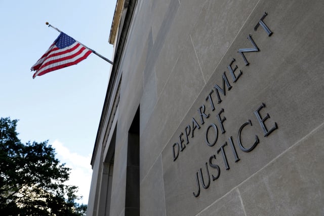Signage is seen at the United States Department of Justice headquarters in Washington, D.C., U.S., August 29, 2020. REUTERS/Andrew Kelly/File Photo
