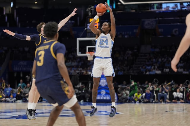 Mar 12, 2025; Charlotte, NC, USA; North Carolina Tar Heels forward Jae'Lyn Withers (24) shoots from long range against the Notre Dame Fighting Irish during the second half at Spectrum Center. Mandatory Credit: Jim Dedmon-Imagn Images