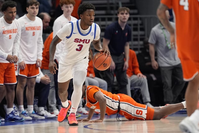 Mar 12, 2025; Charlotte, NC, USA; Southern Methodist Mustangs guard Chuck Harris (3) comes away with the rebound and brings the ball up court against the Syracuse Orange during the second half at Spectrum Center. Mandatory Credit: Jim Dedmon-Imagn Images