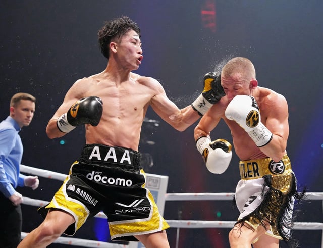 Naoya Inoue of Japan throws a punch at Paul Butler of Britain during their bantamweight title unification boxing match of WBA, WBC, IBF and WBO in Tokyo, Japan, December 13, 2022, in this photo released by Kyodo. Kyodo via REUTERS/File Photo