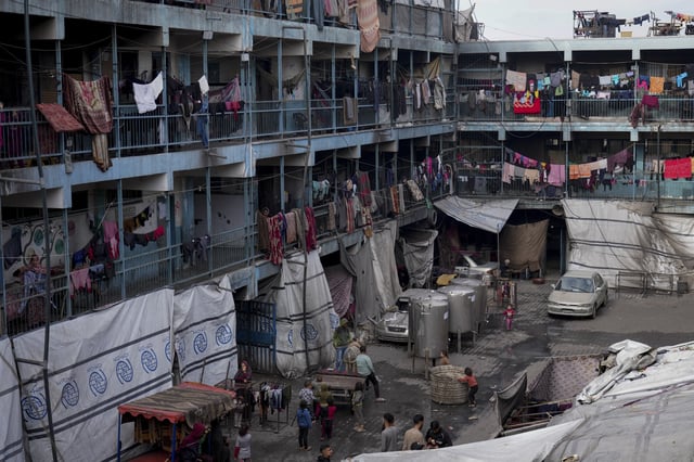 Displaced Palestinians lives in a school run by UNRWA, the U.N. agency helping Palestinian refugees, west of Gaza City, Sunday, March 9, 2025. (AP Photo/Jehad Alshrafi)