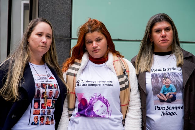 Victims of Brazilian dam collapse Gelvana Silva, Monia Dos Santos and Pamela Fernandes pose for pictures outside City Court House, Rolls Building ahead of the final day of the lawsuit against BHP in London, Britain, March 13, 2025. REUTERS/Marissa Davison