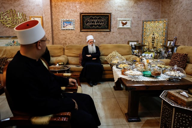 Leader of the Druze community in Israel Sheikh Mowafaq Tarif speaks with Reuters at his house in Julis, northern Israel March 13, 2025 REUTERS/Ammar Awad
