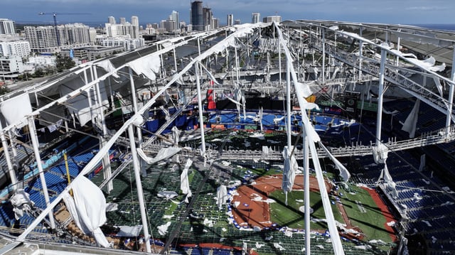 In this aerial view, the roof of Tropicana Field is seen in tatters after Hurricane Milton destroyed it as the storm passed through the area on October 10, 2024, in St. Petersburg, Florida.