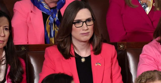 Rep. Sarah McBride (D-DE) listens as U.S. President Donald Trump's gives a speech to a joint session of Congress, in the House Chamber of the U.S. Capitol in Washington, D.C., U.S., March 4, 2025. REUTERS/Evelyn Hockstein