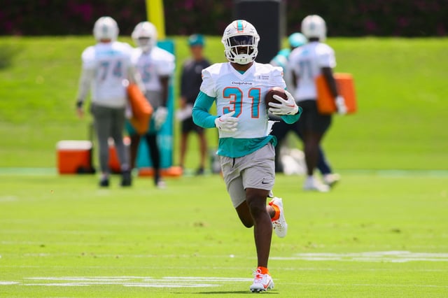 Jun 4, 2024; Miami Gardens, FL, USA; Miami Dolphins running back Raheem Mostert (31) runs with the football during mandatory minicamp at Baptist Health Training Complex. Mandatory Credit: Sam Navarro-USA TODAY Sports/File Photo