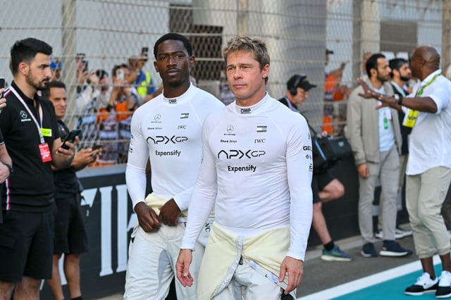 "F1" stars Damson Idris (left) and Brad Pitt arrive before the start of the Abu Dhabi Formula 1 Grand Prix at the Yas Marina Circuit on Dec. 8, 2024.