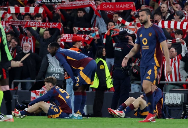 Soccer Football - Europa League - Round of 16 - Second Leg - Athletic Bilbao v AS Roma - San Mames, Bilbao, Spain - March 13, 2025 Athletic Bilbao fans celebrate after the match as AS Roma's Bryan Cristante looks dejected REUTERS/Vincent West