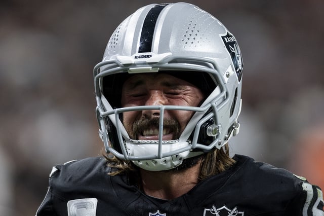 Gardner Minshew #15 of the Las Vegas Raiders reacts to an apparent injury as he walks off the field during an NFL Football game against the Denver Broncos at Allegiant Stadium on November 24, 2024 in Las Vegas, Nevada.