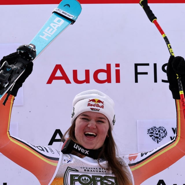 The winner Germany's Emma Aicher celebrates after an alpine ski, women's World Cup super G race, in La Thuile, Italy, Thursday, March 13, 2025. (AP Photo/Marco Trovati)