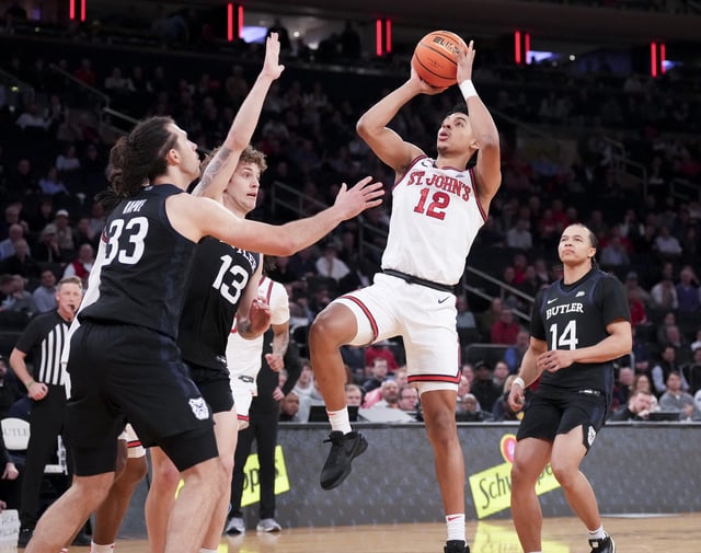 Mar 13, 2025; New York, NY, USA;  St. John's Red Storm guard RJ Luis Jr. (12) shoots past Butler Bulldogs during the first half at Madison Square Garden. Mandatory Credit: Robert Deutsch-Imagn Images