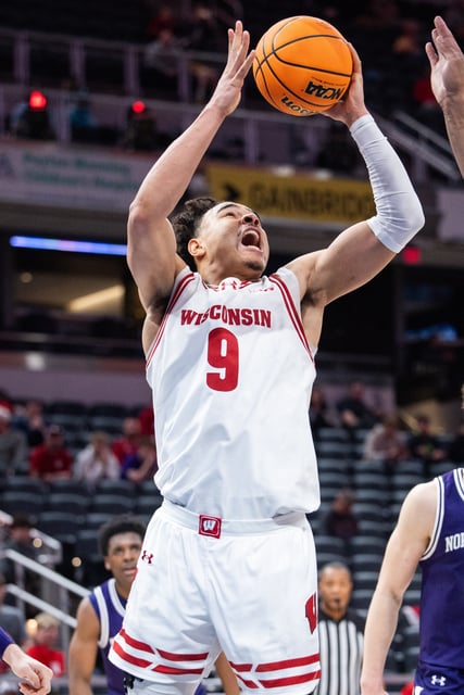 Mar 13, 2025; Indianapolis, IN, USA; Wisconsin Badgers guard John Tonje (9) shoots the ball  in the second half against the Northwestern Wildcats at Gainbridge Fieldhouse. Mandatory Credit: Trevor Ruszkowski-Imagn Images