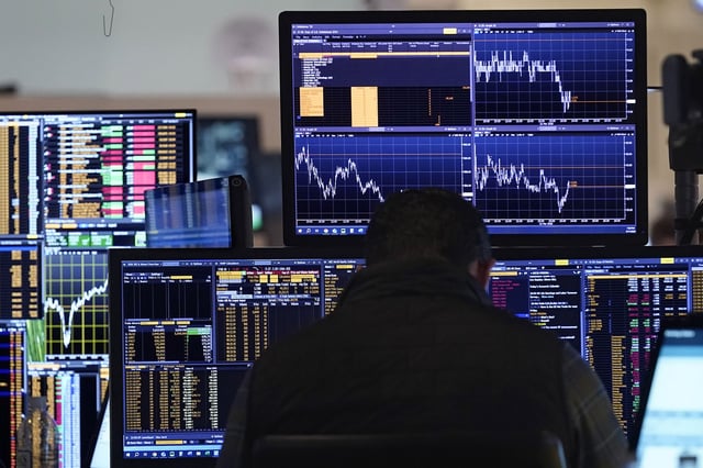 A trader works on the floor of the New York Stock Exchange, Tuesday, March 11, 2025.