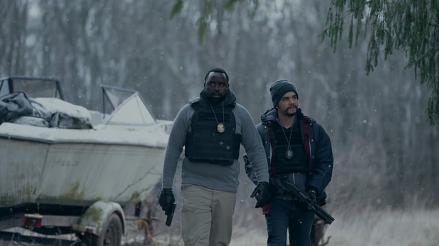 Brian Tyree Henry and Wagner Moura holding guns in Apple TV+ series Dope Thief.