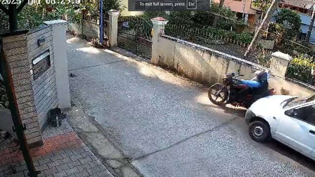 Screengrab from viral video where a BSNL employee rammed his car into a biker. 