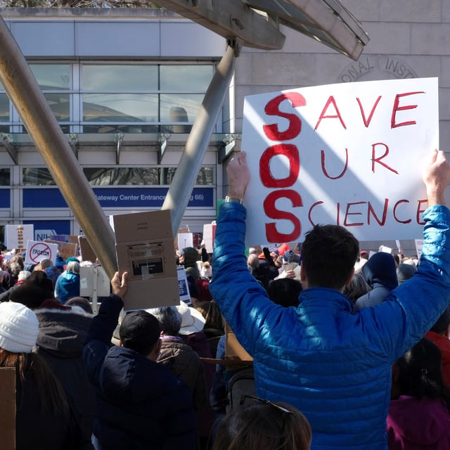 Demonstrators protest funding cuts outside of the National Institutes of Health (NIH) in Bethesda, Maryland, on March 8, 2025. (Photo by Michael Mathes / AFP) (Photo by MICHAEL MATHES/AFP via Getty Images)