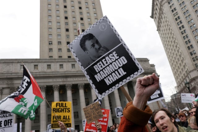 Demonstrators hold placards as they protest on the day of a hearing on the detention of Palestinian activist and Columbia University graduate student Mahmoud Khalil, in New York City, U.S., March 12, 2025. REUTERS/Jeenah Moon/File Photo