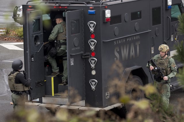 (File photo) Members of a SWAT team work in a parking lot after a threat of an active shooter shut down campus at Highline College on February 16, 2018 in Des Moines, Washington.