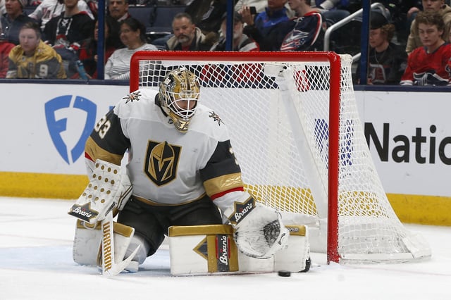 Mar 13, 2025; Columbus, Ohio, USA; Vegas Golden Knights goalie Adin Hill (33) makes a pad save against the Columbus Blue Jackets during the third period at Nationwide Arena. Mandatory Credit: Russell LaBounty-Imagn Images/File Photo