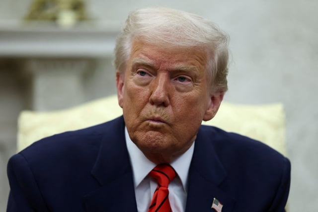 U.S. President Donald Trump reacts as he meets NATO Secretary General Mark Rutte (not pictured), in the Oval Office at the White House in Washington, D.C., U.S., March 13, 2025. REUTERS/Evelyn Hockstein