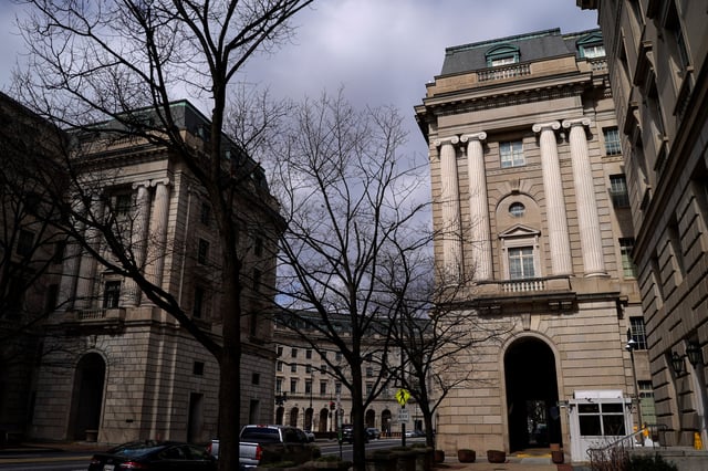 The U.S. Internal Revenue Service (IRS) and the Environmental Protection Agency (EPA) buildings stand after it was reported the IRS will lay off about 6,700 employees, a restructuring that could strain the tax-collecting agency's resources during the critical tax-filing season, in Washington, D.C., February 20, 2025. REUTERS/Kent Nishimura/File Photo
