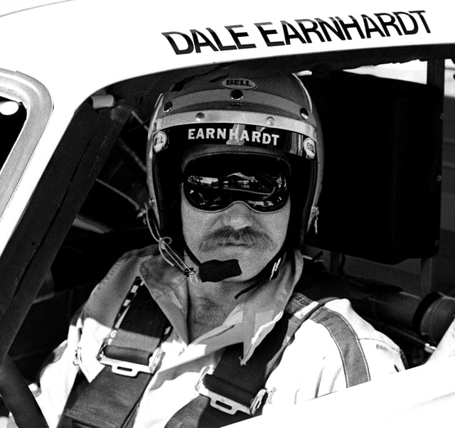 NASCAR driver Dale Earnhardt Sr. sits in his car at the Daytona International Speedway prior to the start of the 1980 Daytona 500 on February 17, 1980 in Daytona Beach, Florida.