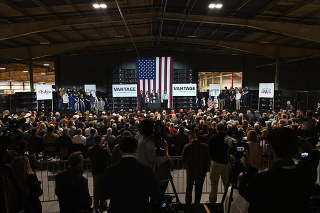 Vice President JD Vance, center stage, speaks at a rally about "America's industrial resurgence," Friday, March 14, 2025, at Vantage Plastics in Bay City, Mich. (AP Photo/Jose Juarez)