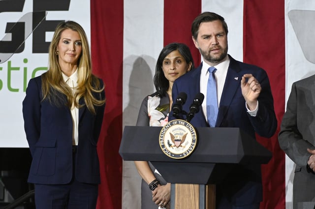 Vice President JD Vance, right, speaks at a rally about "America's industrial resurgence," as he is flanked by Administrator of the Small Business Administration Kelly Loeffler, far left, and his wife, Usha Vance, Friday, March 14, 2025, at Vantage Plastics in Bay City, Mich. (AP Photo/Jose Juarez)