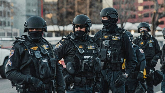 A group of armed SWAT officers.