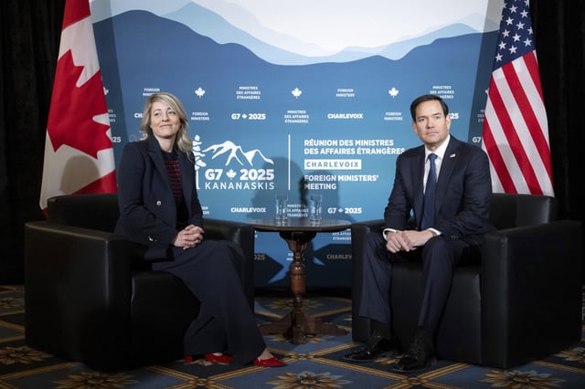 Canadian Foreign Minister Melanie Joly sits with U.S. Secretary of State Marco Rubio during the G7 meeting of foreign ministers in Charlevoix, Quebec, Thursday, March 13, 2025. (Saul Loeb/Pool via AP)