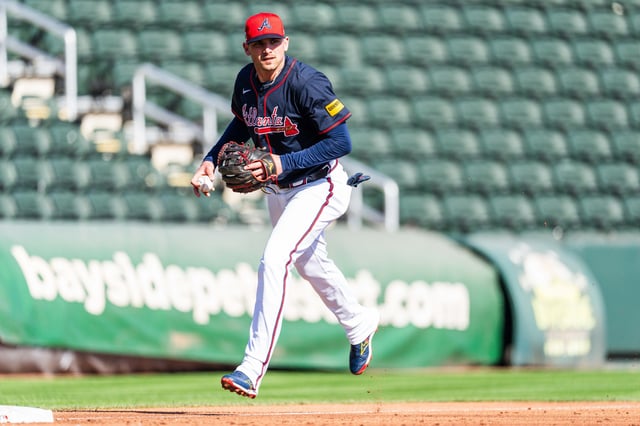 NORTH PORT, FLORIDA - FEBRUARY 21: Austin Riley #27 of the Atlanta Braves throws the ball during a spring training workout at CoolToday Park on February 21, 2025 in North Port, Florida.
