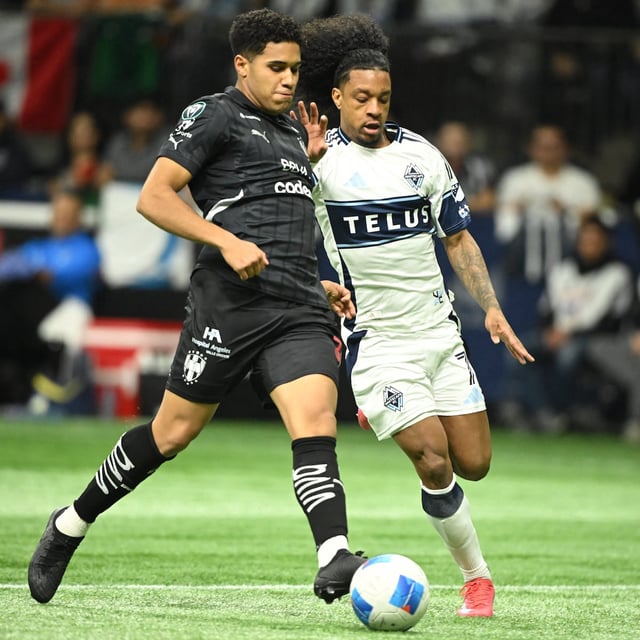 Mar 5, 2025; Vancouver, British Columbia, CAN;  CF Monterrey midfielder Antonio Leone (32) battles for the ball against Vancouver Whitecaps FC forward Jayden Nelson (7) during the first half at BC Place. Mandatory Credit: Anne-Marie Sorvin-Imagn Images
