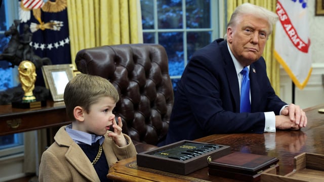 U.S. President Donald Trump looks on as X Æ A-12, Elon Musk's son, stands beside him in the Oval Office of the White House in Washington, D.C., U.S., February 11, 2025. REUTERS/Kevin Lamarque TPX IMAGES OF THE DAY